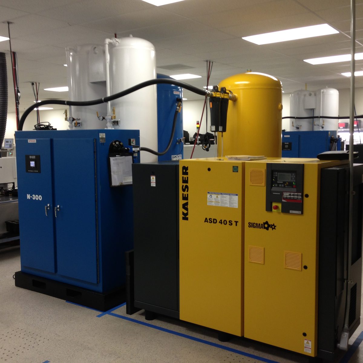 GGS N-300 nitrogen generator installed on an SMT electronics manufacturing line, feeding reflow and wave solder equipment.