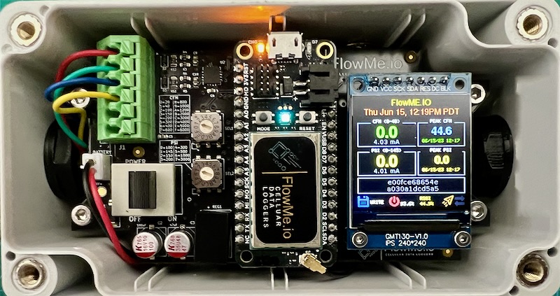 Closeup of a digital nitrogen flowmeter paired with a cellular data logger