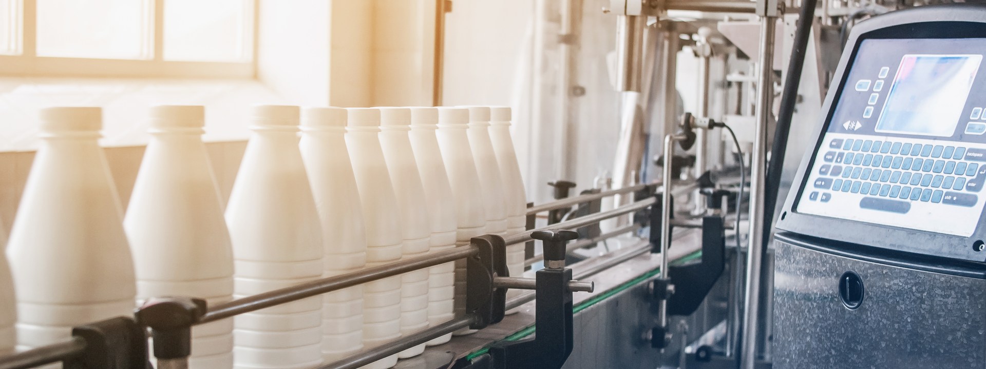Milk bottles on a dairy packaging line supplied by an on-site nitrogen generator